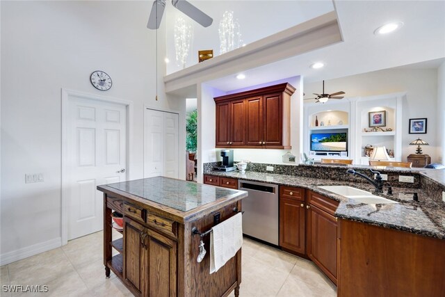 kitchen with light tile patterned floors, sink, stainless steel dishwasher, and ceiling fan