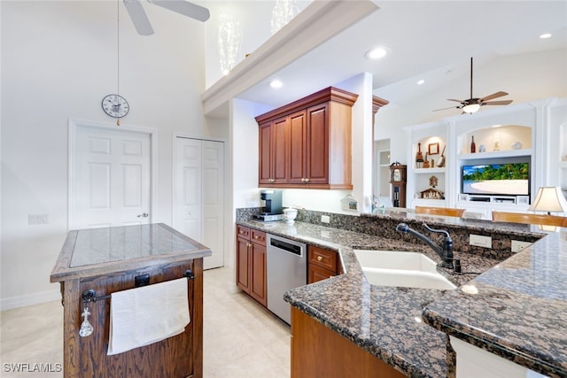 kitchen with a sink, built in shelves, dishwasher, and ceiling fan