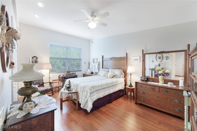 bedroom featuring hardwood / wood-style flooring and ceiling fan