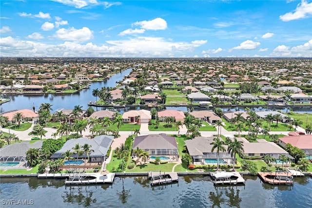 bird's eye view with a residential view and a water view