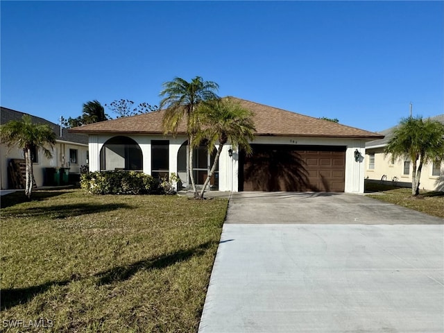 ranch-style house featuring a garage and a front yard