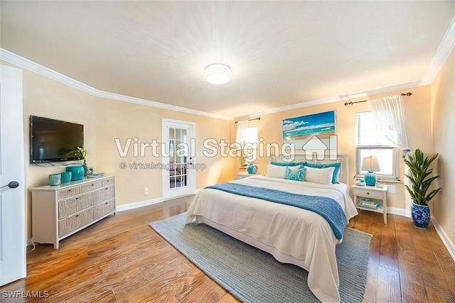 bedroom with hardwood / wood-style flooring and crown molding