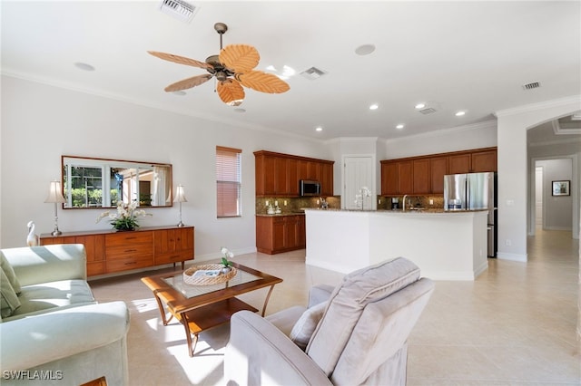 living room featuring ornamental molding, ceiling fan, and light tile patterned flooring