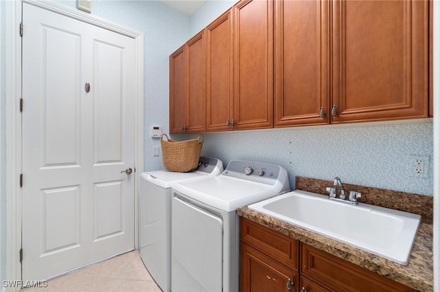 laundry room with separate washer and dryer, cabinets, sink, and light tile patterned flooring