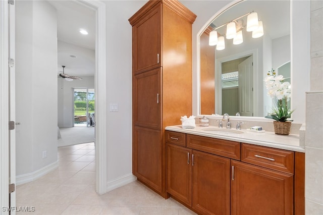 bathroom featuring tile patterned flooring, vanity, and ceiling fan