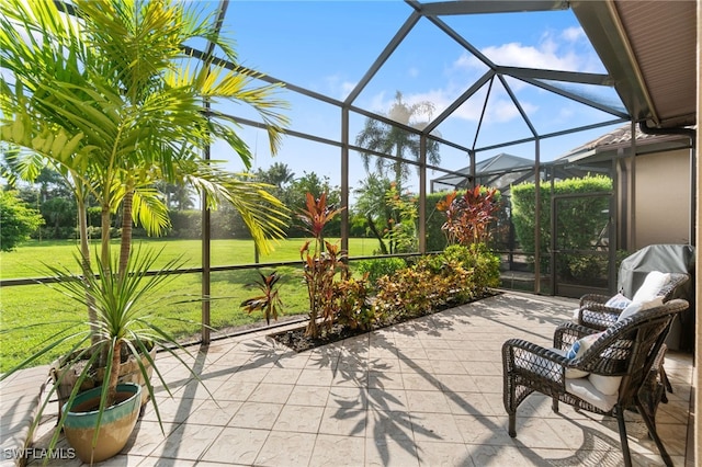 view of patio / terrace featuring a lanai