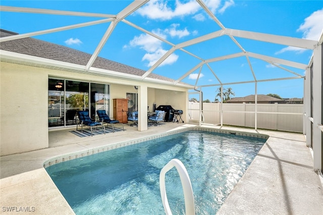 view of pool featuring a lanai and a patio area