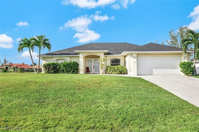 view of front of property with a front yard and a garage