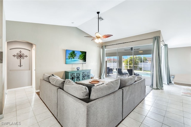 tiled living room featuring ceiling fan and lofted ceiling