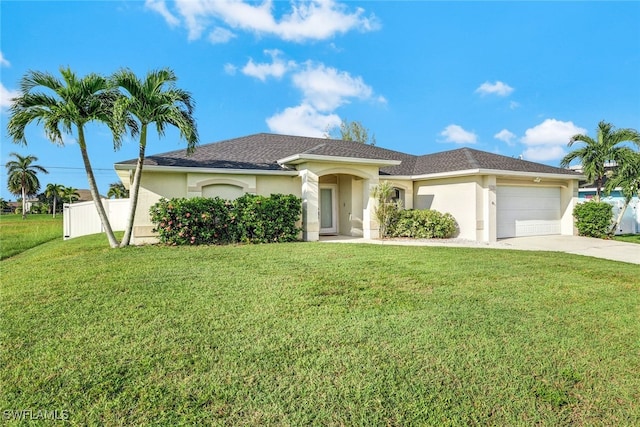 view of front facade with a front yard and a garage