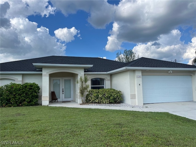 ranch-style home with a garage and a front lawn