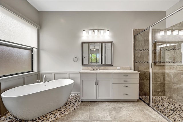 bathroom with vanity, tile patterned floors, and shower with separate bathtub