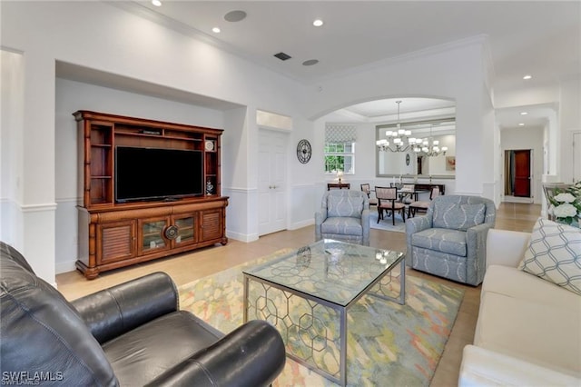 living room with arched walkways, a notable chandelier, recessed lighting, visible vents, and ornamental molding