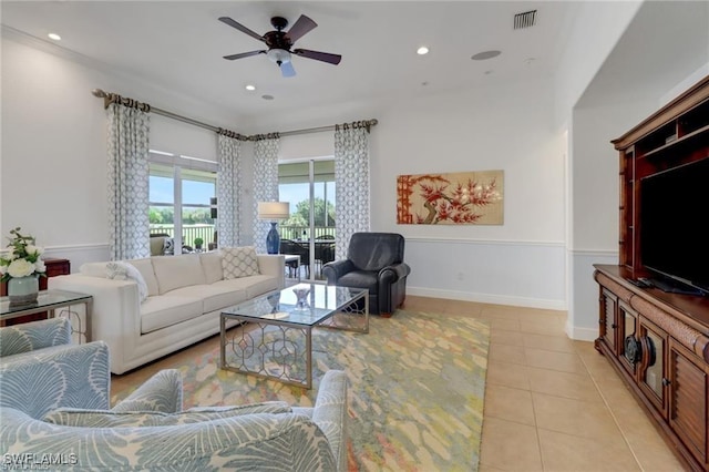 living room featuring light tile patterned flooring, recessed lighting, a ceiling fan, baseboards, and visible vents