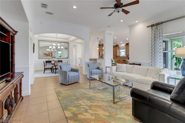 living area featuring recessed lighting, arched walkways, crown molding, and light tile patterned flooring