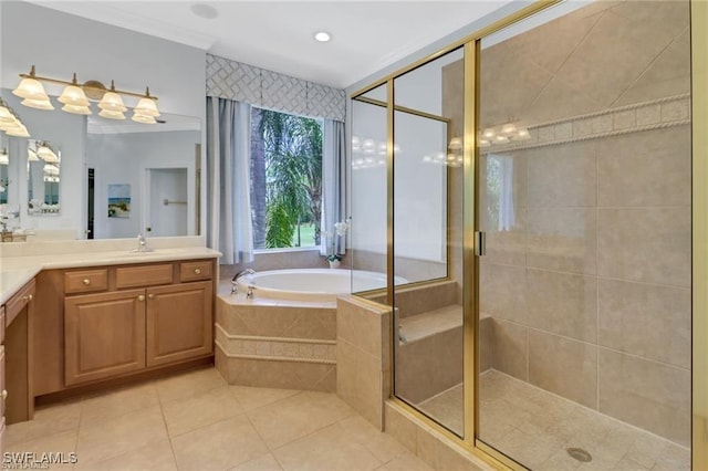 full bathroom featuring tile patterned flooring, a shower stall, a bath, and vanity