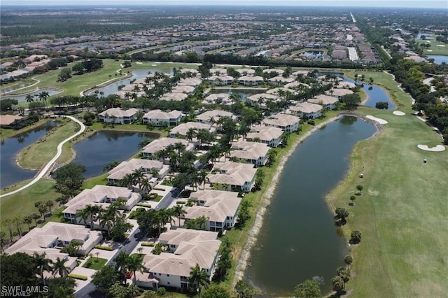 birds eye view of property featuring a residential view, view of golf course, and a water view