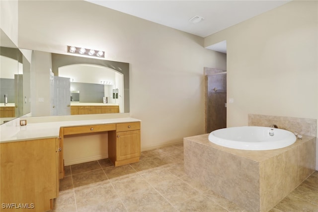 bathroom with vanity, plus walk in shower, and tile patterned floors