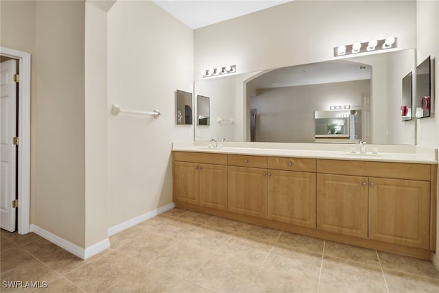 bathroom featuring tile patterned floors and vanity