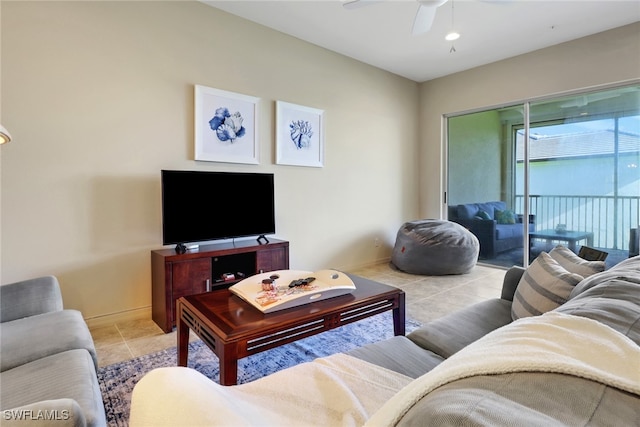 living room featuring ceiling fan and light tile patterned flooring