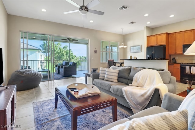 tiled living room with ceiling fan