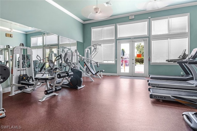 exercise room with ceiling fan, ornamental molding, and french doors