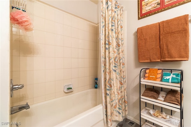 bathroom with shower / bath combination with curtain