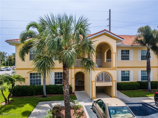 view of front of home with a balcony