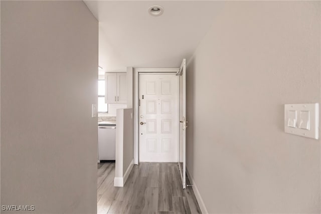 corridor featuring light hardwood / wood-style floors