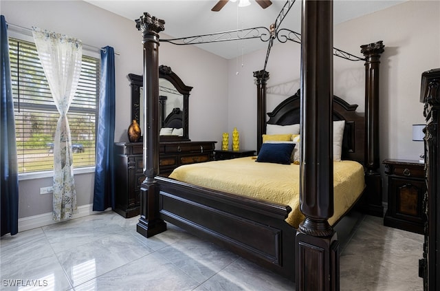 tiled bedroom featuring ceiling fan