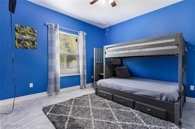 bedroom featuring ceiling fan and light tile patterned flooring