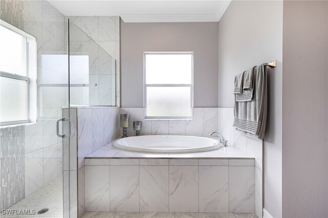 bathroom featuring plus walk in shower and tile patterned floors