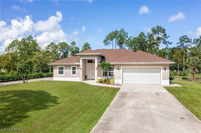 view of front of home featuring a front yard, an attached garage, and stucco siding