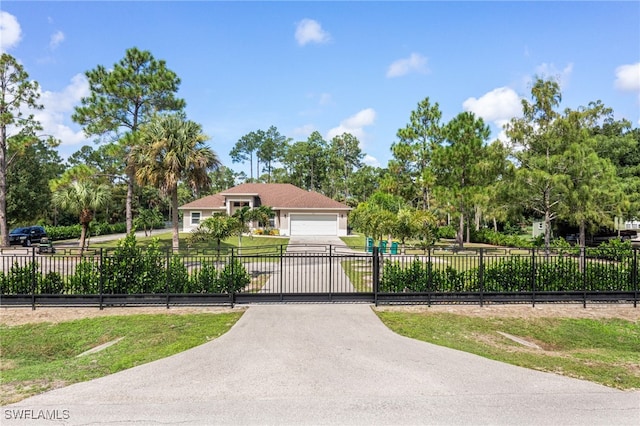 view of gate with a garage