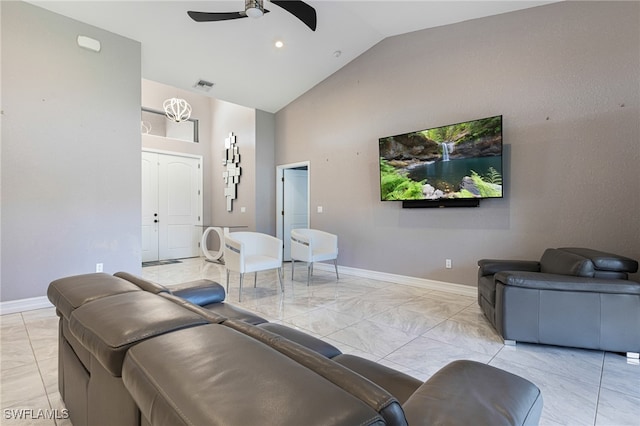 tiled living room with ceiling fan and vaulted ceiling