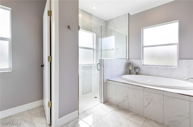 bathroom featuring tile patterned floors and independent shower and bath