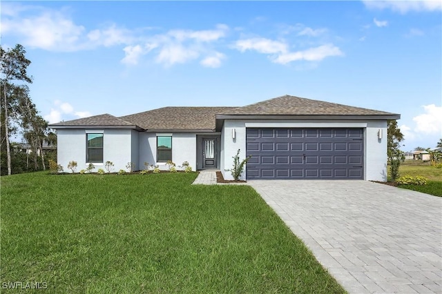 view of front facade with a garage, roof with shingles, decorative driveway, stucco siding, and a front yard