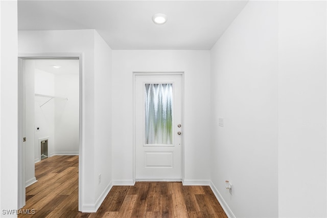 doorway to outside with dark wood-type flooring