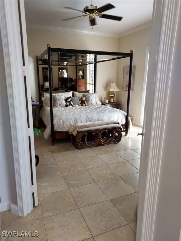 bedroom with ceiling fan, crown molding, and light tile patterned floors