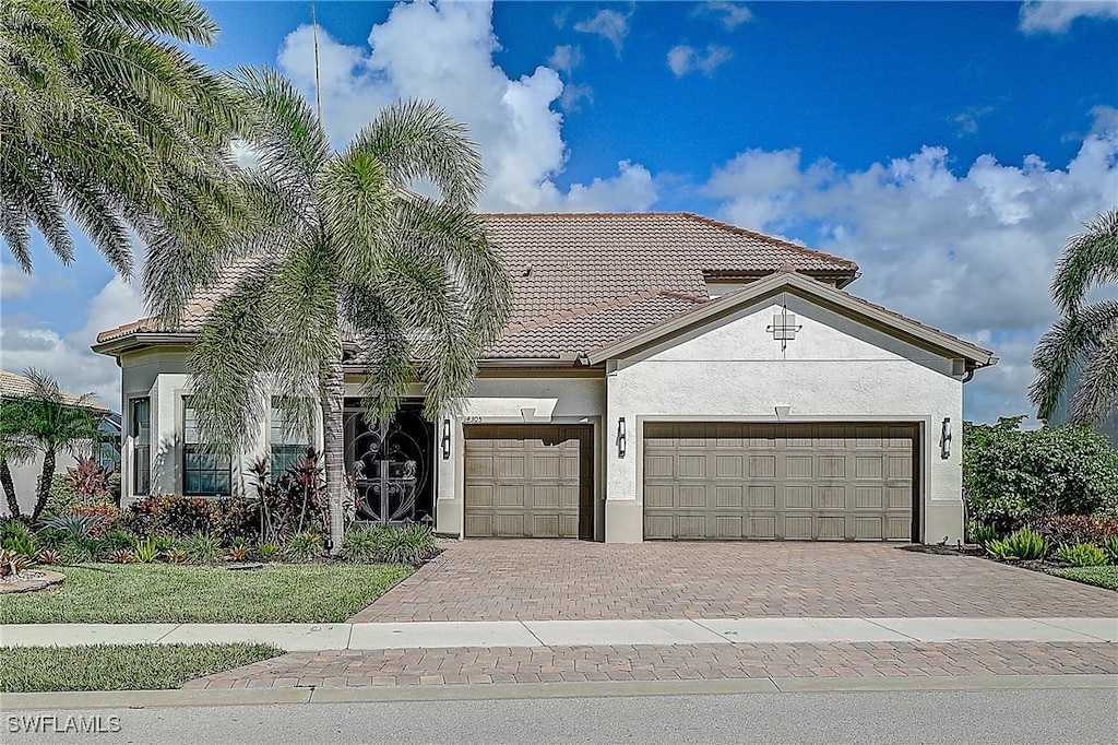 mediterranean / spanish house featuring a garage