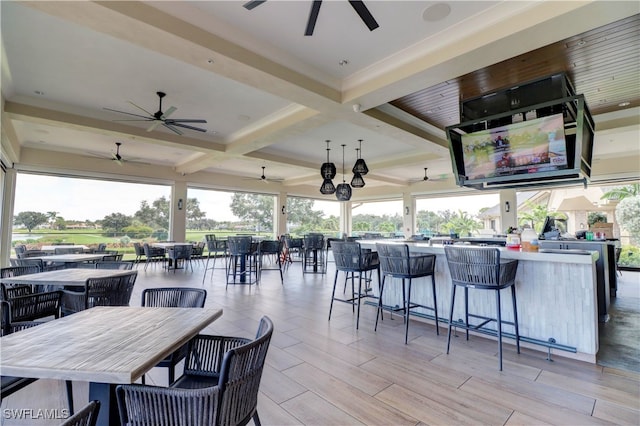 view of patio featuring an outdoor bar and ceiling fan