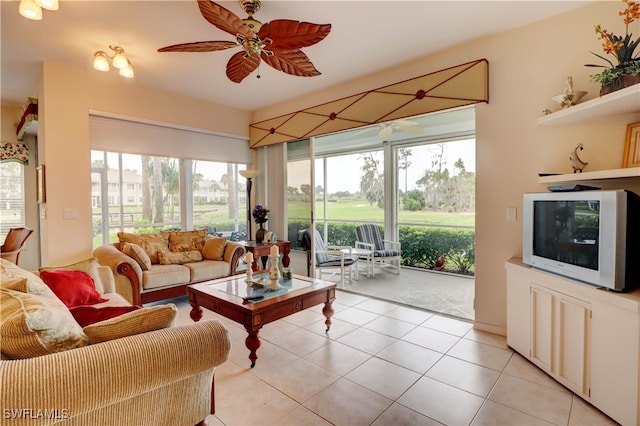 living room with ceiling fan and light tile patterned floors