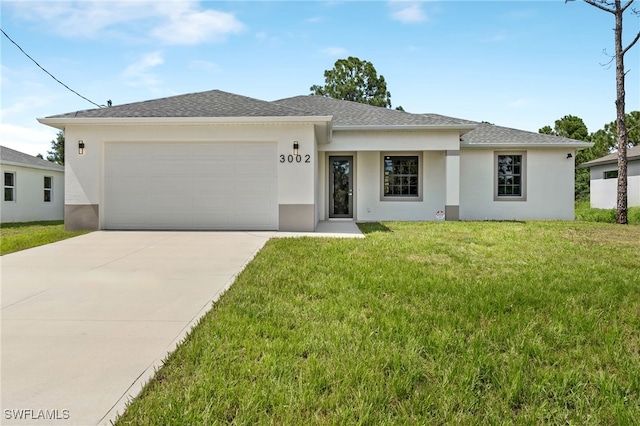 view of front of home featuring an attached garage, stucco siding, concrete driveway, and a front yard