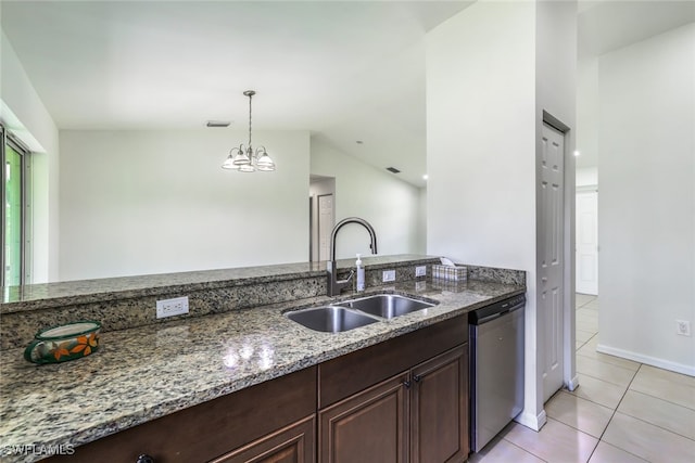 kitchen with sink, hanging light fixtures, light tile patterned floors, stainless steel dishwasher, and light stone countertops