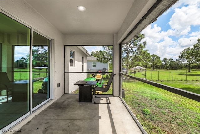 unfurnished sunroom featuring a healthy amount of sunlight