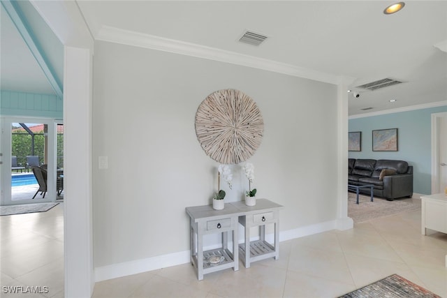 corridor featuring crown molding and light tile patterned flooring