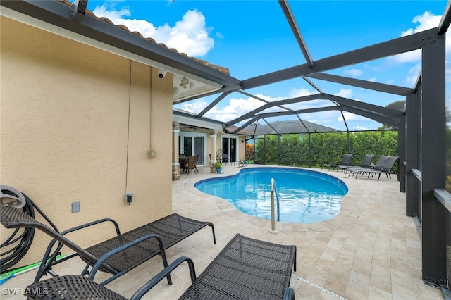 view of pool featuring a lanai and a patio