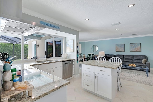 kitchen featuring white cabinets, a wealth of natural light, sink, and stainless steel dishwasher