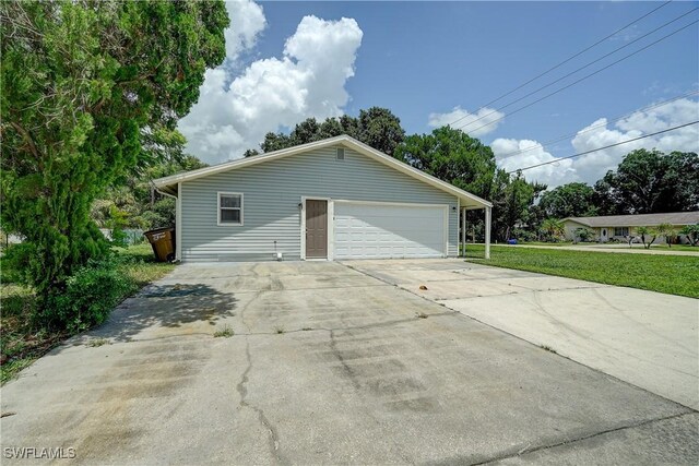 view of home's exterior featuring a yard and a garage