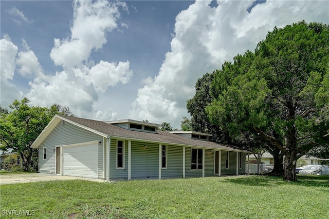 view of front facade with a garage and a front yard